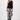 Black sleeveless linen top with tape detailing by Zusss, worn by a model.