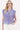 The model is wearing a sky-blue checkered blouse by Zusss, a soft checkered blouse.