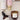 Set van Zusss bath- en slaapkamerproducten met bodylotion this moment is gold sand, pastel flessen en amber potjes, van Zusss.