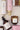 Set van Zusss bath- en slaapkamerproducten met bodylotion this moment is gold sand, pastel flessen en amber potjes, van Zusss.