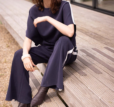 wideleg jogger broek met zijbies | off white / dark navy