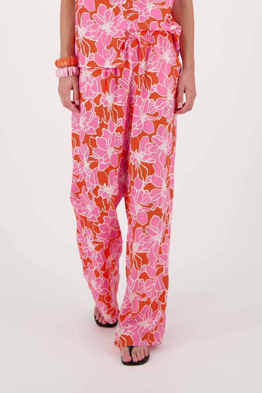pants with floral print | bright pink / orange