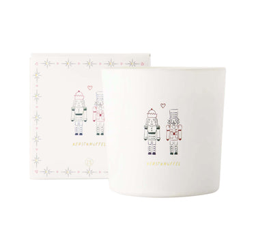 Scented candle in a glass jar, in a box with nutcrackers and a white Christmas plush toy | white