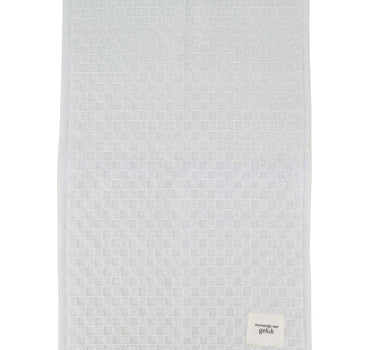 "Moment of Happiness" guest towel in ash blue, a short rectangular bath and bedroom accessory with a woven pattern by Zusss.