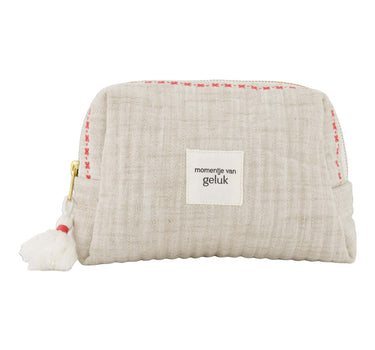 Toilettas momentje van geluk off white / rood van Zusss, compacte katoenen tas met tassel en roze rand.