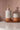 zeepdispenser terracotta love off white van Zusss, keramische fles met gouden pomp op terracotta tray.